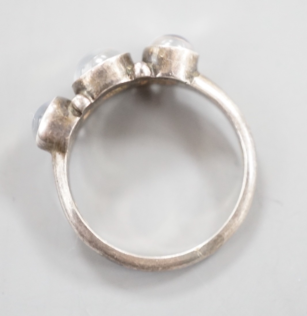 A Georg Jensen sterling 925 and three stone cabochon moonstone set half hoop ring, no. 3, size M/N, in Georg Jensen box.